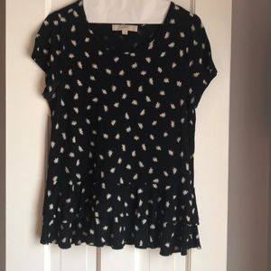 Black Loft blouse with dandelions on it